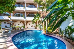 a swimming pool in front of a building at Charming Colonial Mexican Hacienda in Puerto Vallarta