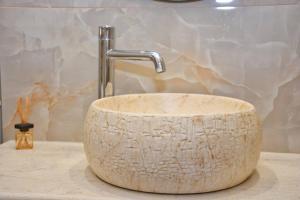 a bathroom sink with a marble counter top at Casa Vyron in Ipsos