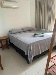 Ένα ή περισσότερα κρεβάτια σε δωμάτιο στο Meu cantinho no paraíso!