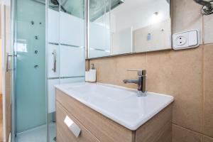 a bathroom with a sink and a shower at Casa da Ria by east ALgarve guest in Santa Luzia +31 photos