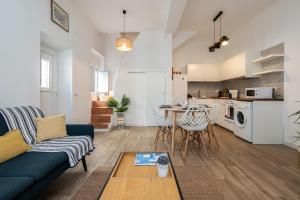 a living room with a couch and a table at Casa da Ria by east ALgarve guest in Santa Luzia