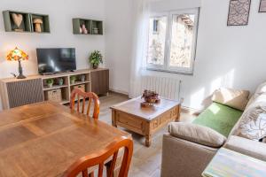 Svetainės erdvė apgyvendinimo įstaigoje Apartamentos Ondina