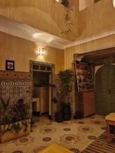a room with a kitchen and a living room at Medina Oasis Hostel in Marrakech