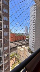 a view of a building under construction from a balcony at Estúdio a 500m Metro Joao Dias in Sao Paulo