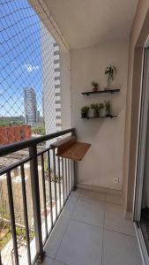 a balcony with a bench and a view of a building at Estúdio a 500m Metro Joao Dias in Sao Paulo