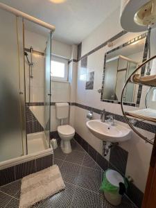 Koupelna v ubytování Apartmani 4 Delfina Rogoznica