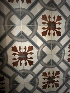 a close up of a tile floor with patterns on it at Holiday Home Cosimo in Locorotondo
