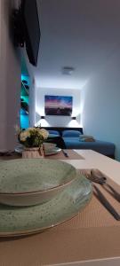 a table with a plate on top of a room at Studio Apartment FortyOne in Orebić