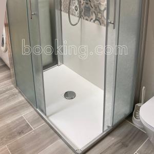 a shower with a glass door in a bathroom at InternoUno in Diamante