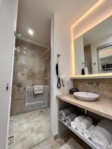 a bathroom with a sink and a shower at Luxury Escape in Nuevo Vallarta  +5 photos