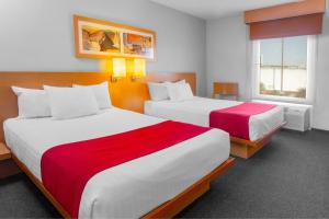 Postel nebo postele na pokoji v ubytování City Express by Marriott Celaya Parque