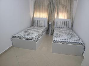 Katil atau katil-katil dalam bilik di Appartment in Tanger City Center near to the beach