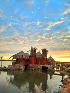 a resort in the middle of the water at Marassina camp in Siwa