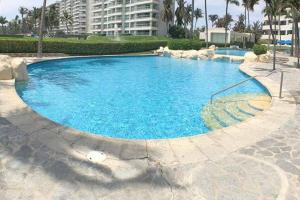 Bazén v ubytování Increíble depto. en playa privada. nebo v jeho okolí