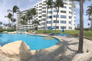 Bazén v ubytování Increíble depto. en playa privada. nebo v jeho okolí