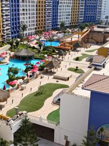 an aerial view of a resort with two pools at Porto marina in El Alamein