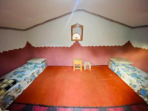 Postel nebo postele na pokoji v ubytování Auberge L'Oasis Mhamid