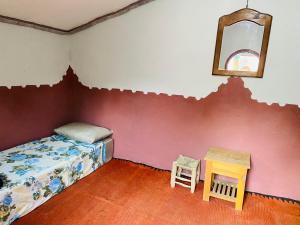 Postel nebo postele na pokoji v ubytování Auberge L'Oasis Mhamid