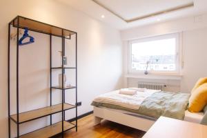 Ένα ή περισσότερα κρεβάτια σε δωμάτιο στο Cozy Kyōto Room - Homestay - Doppelzimmer mit Gemeinschaftsbad