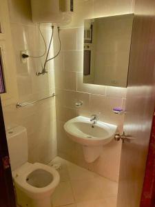 a bathroom with a toilet and a sink at Porto sokhna pyramids in Ain Sokhna