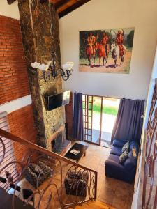 a living room with a couch and a fireplace at Villa Lakota By Natut Huasca in Huasca de Ocampo