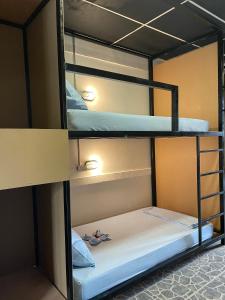 a bunk bed room with two bunk beds in it at Asha Hostel in Fortuna