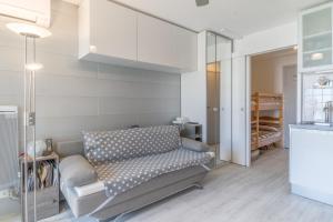a living room with a couch and a chair at Appt t2 cabine clim parking privée vu mer in Sète