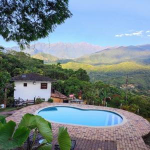 a swimming pool with a view of mountains at Habitacion The View in Cali