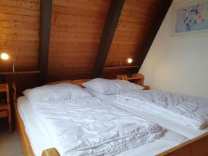 Postel nebo postele na pokoji v ubytování Nurdachhaus AUSZEIT