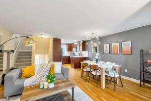 a living room with a couch and a table at Wallingford Modern Home with Designer's Touch - 95 walk score in Seattle