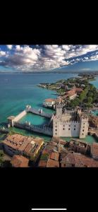 an aerial view of a city next to the ocean at B&B Happy Days Affittacamere in Sirmione
