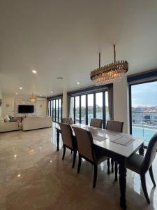a large dining room with a table and chairs at Penthouse Berawa - Canggu in Canggu