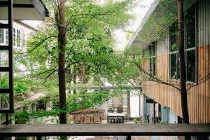 an outside view of a building with a table and chairs at Eia by Dawata Boutique Stay, Yoga & Cafe in Cebu City