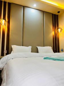 Postelja oz. postelje v sobi nastanitve Hotel Balgopal