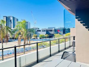 a balcony with a view of a city at CASSA TOOWONG - Convenient 1B Apt at Central Location with Parking Managed by The Cassa in Brisbane