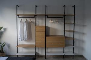 a room with a closet with wooden shelves at Nouvel Appartement Moderne À La Corniche De Bizerte in Bizerte