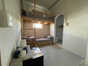 Postel nebo postele na pokoji v ubytování 春色領地 Vibelance inn