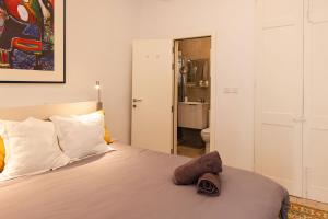 מיטה או מיטות בחדר ב-Casa Nico