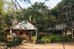 a small house in the middle of a forest at Sai Vishram Beach Resort in Baindūru