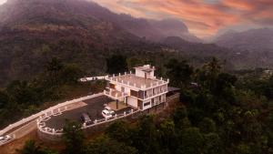 an aerial view of a house in the mountains at Karickanattu Nature Resort in Idukki