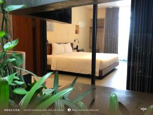 Postel nebo postele na pokoji v ubytování Shelter Stay Da Nang + 4 fotografie