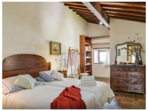 Un pat sau paturi într-o cameră la Villa Cavallari