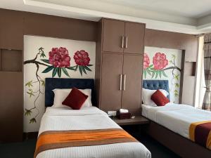 Rúm í herbergi á Hotel Kathmandu square