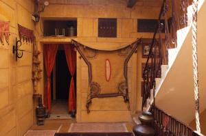 a hallway of a house with a door in the floor at Killa Bhawan Lodge in Jaisalmer