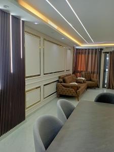 a conference room with a table and chairs at Sun capital compound شقه بكمبوند حدائق اكتوبر in Giza +15 photos