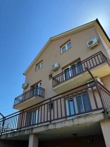 a building with balconies on the side of it at Pansion Ivanka Barac in Međugorje