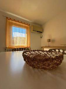 a couch sitting on a table in a room with a window at Endless Summer in Marina di Montemarciano +12 photos