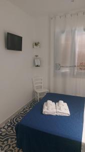 Llit o llits en una habitació de Benvenuti al Sud B&B