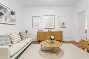 a living room with a couch and a coffee table at Victorian Apartment in Lifestyle Hotspot in Sydney