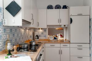 Η κουζίνα ή μικρή κουζίνα στο Sylter Seestern Haus Jölhuk +16 φωτογραφίες